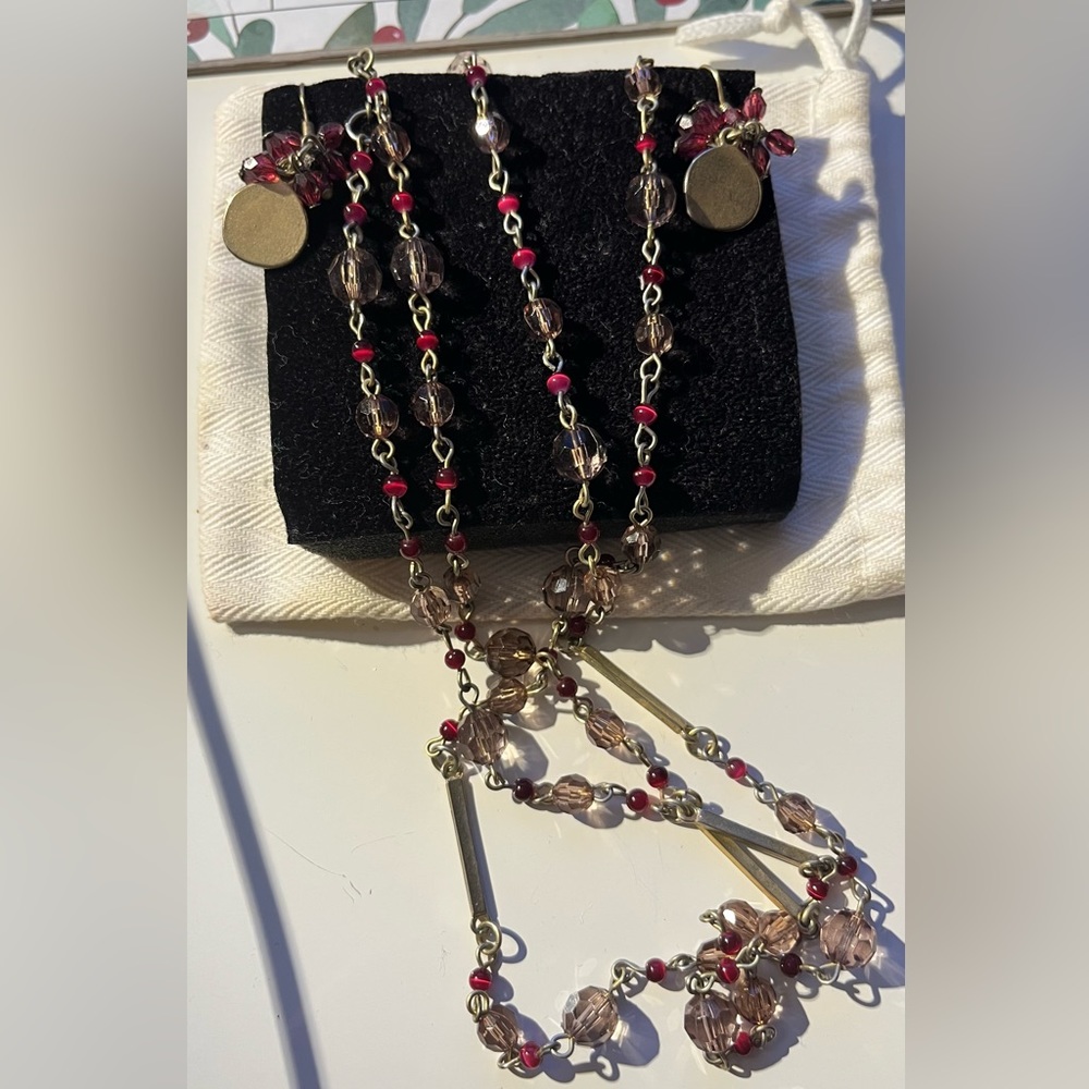 set of dangling earrings and necklace.